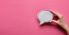 hand holding comment bubble. The undeniable power of social commenting
