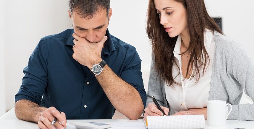 Good Debt vs. Bad Debt: How to Distinguish and Repay Debts 2 couple looking at debt good debt vs bad debt
